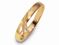 Vigselring Flemming Uziel Signo B41506 i 18 k guld med diamant.